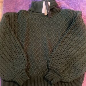 Green knot turtle neck sweater
